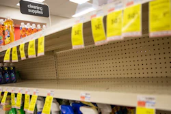 In this March 4, 2020 file photo, shelves where disinfectant wipes and sprays are usually displayed sit empty in a pharmacy in Providence, RI as confirmed cases of the coronavirus rise in the US. Legions of nervous hoarders are stocking up on canned goods, frozen dinners, toilet paper, and cleaning products. Such hoarding that's expected to last for weeks has created big challenges for discounters and grocery stores as well as food delivery services.