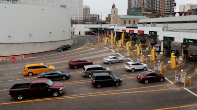 Vehicles enter the United States as a minivan drives to Canada in the Detroit-Windsor Tunnel in Detroit on Monday, March 16.