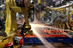 In this May 19, 2011 photo, robots weld a Chevrolet Sonic at the General Motors Orion Assembly plant in Orion Township, MI.