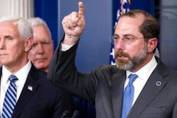 Health and Human Services Secretary Alex Azar speaks, with Vice President Mike Pence behind him, during a briefing about the coronavirus in the James Brady Press Briefing Room of the White House, Sunday, March 15, 2020, in Washington.