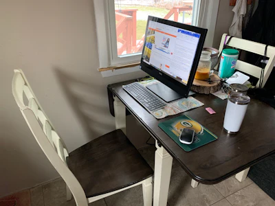 My home work desk for the foreseeable future. Yes, that's a container of disinfectant wipes on the far end.