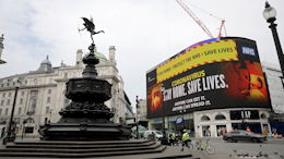 A video screen displays a message urging people to stay home, at Piccadilly Circus in London on Wednesday, April 8. The highly contagious COVID-19 coronavirus has impacted on nations around the globe, many imposing self isolation and exercising social distancing when people move from their homes.