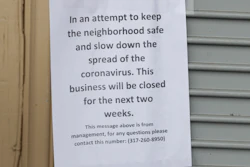 This Saturday, March 28 file photo shows a sign on a liquor store announcing it is closing to keep the neighborhood safe and slow down the COVID-19 coronavirus in Indianapolis.