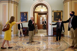 Senate Majority Leader Mitch McConnell of Ky., center, speaks with reporters outside the Senate chamber on Capitol Hill.