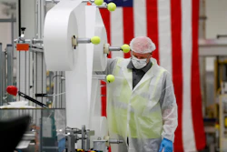 Bill Merkle works on making protective masks in Warren, Mich., April 23, 2020.