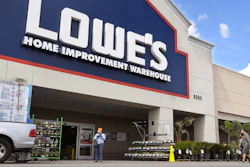 In this March 22 file photo, customers wearing masks walk into a Lowe's home improvement store in the Canoga Park section of Los Angeles. Lowe’s move to revamp its outdated online business in recent months paid off during the first quarter, as shut-in shoppers shifted to its online services for supplies for their do-it-yourself home projects during the pandemic.