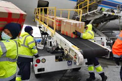 Ground crew unloads medical personal protective equipment from a China Southern Cargo plane, Los Angeles International Airport, April 10, 2020.