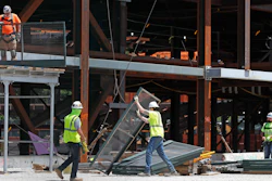 Workers build a protective barrier as construction resumed on the New York Islanders' new arena, located adjacent to Belmont race track, during the current coronavirus outbreak on Wednesday, May 27 in Elmont, NY.