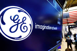 In this Aug. 16, 2019, file photo the logo for General Electric appears above a trading post on the floor of the New York Stock Exchange.