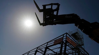 In this March 19, 2020 file photo, a deserted construction site is pictured in Dardilly, near Lyon, central France. The virus crisis has triggered the worst global recession in nearly a century -- and the pain is not over yet even if there is no second wave of infections, an international economic report warned Wednesday.