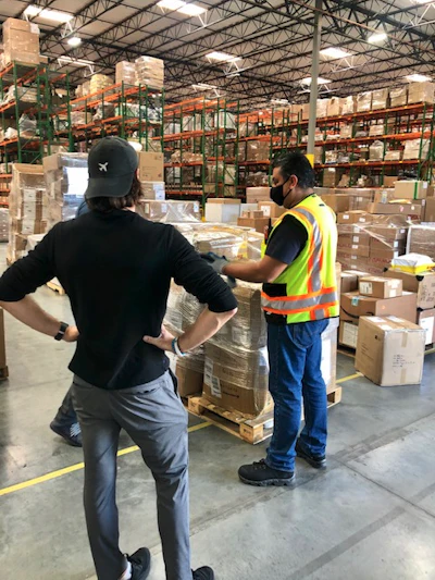 NxTSTOP CEO Brendan Kennedy (foreground) at the warehouse of distribution partner Shipbob.