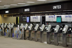 In this April 24 file photo, empty United Airlines ticket machines are shown at the Tampa International Airport in Tampa, FL. United United Airlines will send layoff warnings to 36,000 employees - nearly half its U.S. staff - in the clearest signal yet of how deeply the virus outbreak is hurting the airline industry.