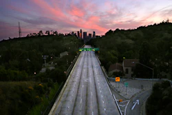 This April 26, 2020, photo shows empty lanes of the 110 Arroyo Seco Parkway that leads to downtown Los Angeles during the coronavirus outbreak in Los Angeles, CA. A record drop in U.S. energy consumption this spring was driven by less demand for coal that's burned for electricity and oil that's refined into gasoline and jet fuel.