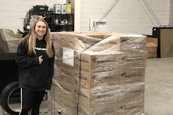 Corinne Cirabisi, HR representative, with packages of non-perishable food items and paper goods to be shipped to each of SupplyHouse.com's distribution centers for their warehouse team.