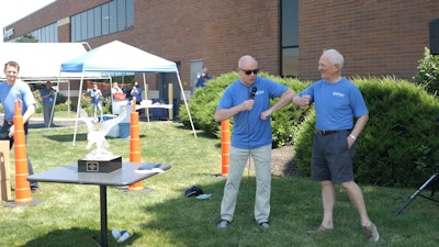 ISA President & CEO Ed Gerber (center) gives a social-distance elbow greeting to Jergens Inc. president Jack Schron (right) as Gerber recently presented Schron with ISA's John J. Buckley Lifetime Achievement Award at Jergens' Cleveland, OH headquarters.