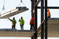 In this Dec. 3, 2019 file photo, workers erect a building under construction in Philadelphia.