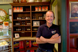 Chicago Alderman Tom Tunney poses inside his main Ann Sather restaurant.
