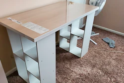 In this photo provided by Megan Fry, a desk Fry constructed out of a legless tabletop and bookcases stands in her Indianapolis home on Sept. 14, 2020.