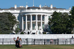 A family takes group portrait outside of the White House in Washington.