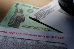 In this April 23 file photo, President Donald Trump's name is seen on a stimulus check issued by the IRS to help combat the adverse economic effects of the COVID-19 outbreak, in San Antonio.