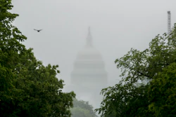 In this May 22, 2020, file photo the Dome of the U.S. Capitol Building is visible through heavy fog in Washington. New virus relief will have to wait until after the November election. Congress is past the point at which it can deliver more coronavirus aid soon, with differences between House Speaker Nancy Pelosi, Senate Republicans and President Donald Trump proving insurmountable.