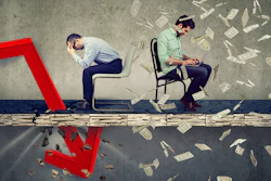 Stressed Businessman Looking Down At Falling Down Arrow Sitting Next To A Successful Guy Working On Laptop Under Money Rain 1058113044 7576x5188 (1)