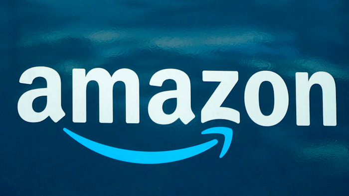 An Amazon logo appears on an Amazon delivery van.