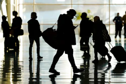 Passengers walk through Salt Lake City International Airport.