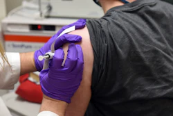 This May 4, 2020, file photo provided by the University of Maryland School of Medicine, shows the first patient enrolled in Pfizer's COVID-19 coronavirus vaccine clinical trial at the University of Maryland School of Medicine in Baltimore.