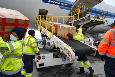 Wearing protective masks, ground crew at the Los Angeles International airport unload supplies of medical personal protective equipment from a China Southern cargo plane upon it's arrival on April 10.