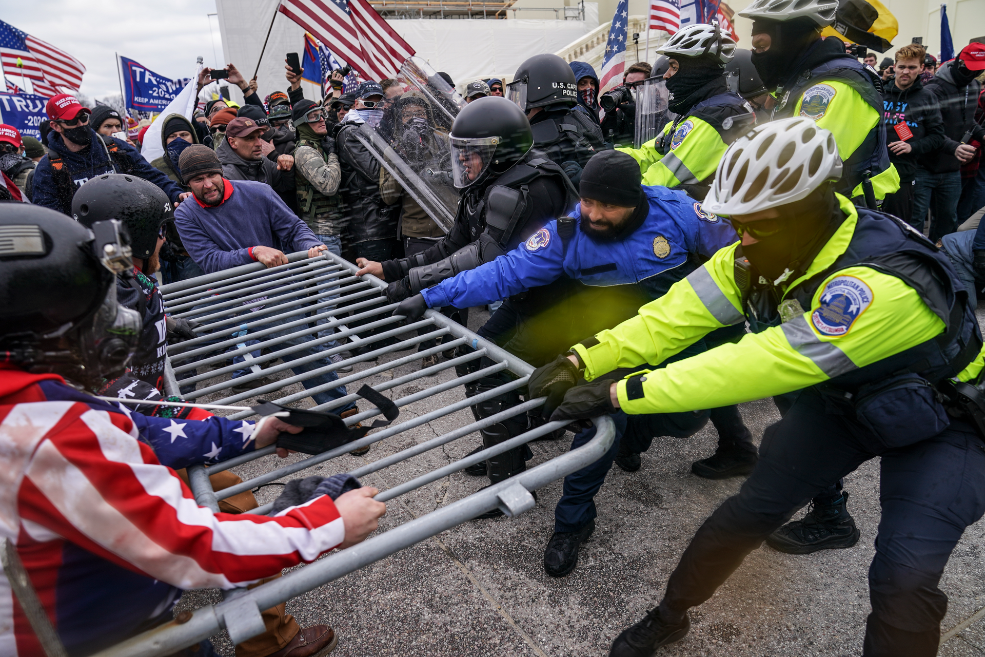 Trump supporters try to break through a police barrier on Wednesday at the Capitol in Washington.