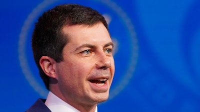 In this Dec. 16, 2020, file photo President-elect Joe Biden's nominee for Transportation Secretary former South Bend, Ind. Mayor Pete Buttigieg, President-elect speaks during a news conference at The Queen theater in Wilmington, Del.