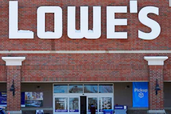 A customer covers his face as he walks to a Lowe's home- improvement store in Vernon Hills, IL on Feb. 3.