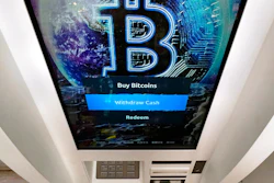 The Bitcoin logo appears on the display screen of a crypto currency ATM at the Smoker's Choice store on Feb. 9 in Salem, NH.