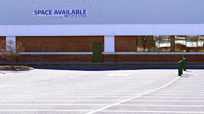 A 'Space Available' real estate sign is posted on the facade of a closed supermarket on March 2 in Manchester, NH.