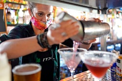Bartender Alyssa Dooley makes a cocktail at Mo's Irish Pub on Tuesday, March 2 in Houston.