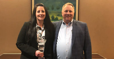 Lawson Products Regional Sales Director Ashley Lucenti with Senior Vice President of Sales Matt Brown after receiving the company's 2018 Founder's Cup — given to the company's top-ranking regional sales director — for a second-straight year.