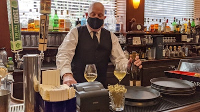 Bartender Dino Keres prepares drinks at Sam’s Grill in San Francisco.