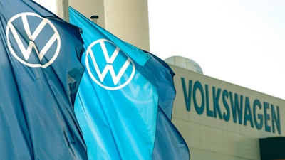 In this file photo dated Thursday, April 23, 2020, company logo flags wave in front of a Volkswagen factory building in Zwickau, Germany. Volkswagen will present its final financial statements for the 2020 financial year, on Tuesday March 16, 2021.
