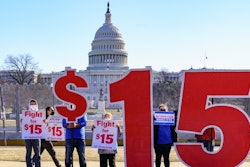 Activists appeal for a $15 minimum wage near the Capitol in Washington, Thursday, Feb. 25, 2021.