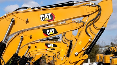 Excavator booms, adorned with the Caterpillar Inc. 'CAT' logo are displayed at the Milton CAT dealership in Londonderry, NH on Feb. 20, 2020.
