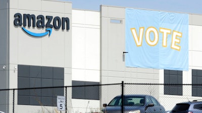 In this March 30 photo, a banner encouraging workers to vote in labor balloting is shown at an Amazon warehouse in Bessemer, Ala.