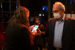 A man presents his 'green passport,' proof that he is vaccinated against the coronavirus, at the Khan Theater, Jerusalem, Feb. 23, 2021.