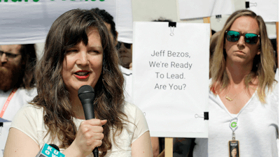 Emily Cunningham, left, speaks as Kathryn Dellinger, right, looks on during a news conference following Amazon's annual shareholders meeting, Wednesday, May 22, 2019, in Seattle.