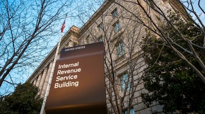 In this April 13, 2014 file photo, the Internal Revenue Service Headquarters (IRS) building is seen in Washington. More than 50 of the largest U.S. companies paid nothing in federal income taxes last year, even though they reported big pretax profits as a group. That's according to the Institute on Taxation and Economic Policy, a group that believes the tax system needs to raise more revenue.