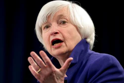 In this Dec. 13, 2017 file photo, Federal Reserve Chair Janet Yellen speaks during a news conference following the Federal Open Market Committee meeting in Washington. Yellen on Monday, April 5, 2021, urged the adoption of a minimum global corporate income tax, an effort to offset any disadvantages that might arise from the Biden administration’s proposed increase in the U.S. corporate tax rate.