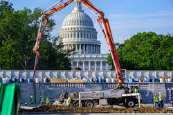 A concrete pump frames the Capitol Dome during renovations and repairs to Lower Senate Park on Capitol Hill in Washington, May 18, 2021.
