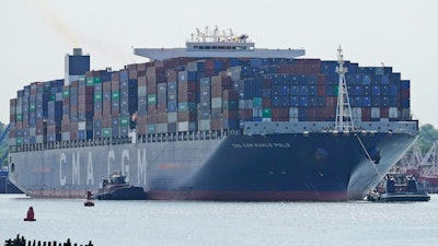 The CMA CGM Marco Polo makes it way toward the Elizabeth-Port Authority Marine Terminal as seen from Bayonne, N.J., Thursday, May 20, 2021. When the CMA CGM Marco Polo docks in New Jersey Thursday it will set a record for the largest container ship ever to visit the East Coast, a reflection both of the New York/New Jersey port system's multibillion-dollar efforts to accommodate larger ships and of the surging demand nationwide for products as COVID-19 restrictions continue to ease.