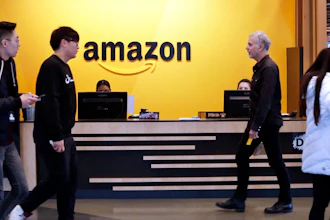 In this Feb. 14, 2019, file photo, people stand in the lobby for Amazon offices in New York. Amazon, which has been under pressure from shoppers, brands and lawmakers to crack down on counterfeits on its site, said Monday, May 10, 2021, that it blocked more than 10 billion suspected phony listings last year before any of their offerings could be sold.