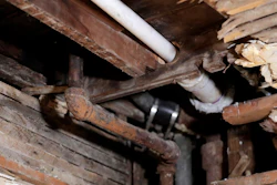 A lead pipe (left) seen through a hole in the kitchen ceiling in the home of Desmond Odom, in Newark, New Jersey.